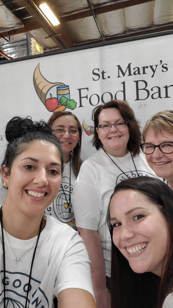 Colleen evans and friends at St. Mary’s food bank in Phoenix Arizona packing food hampers 