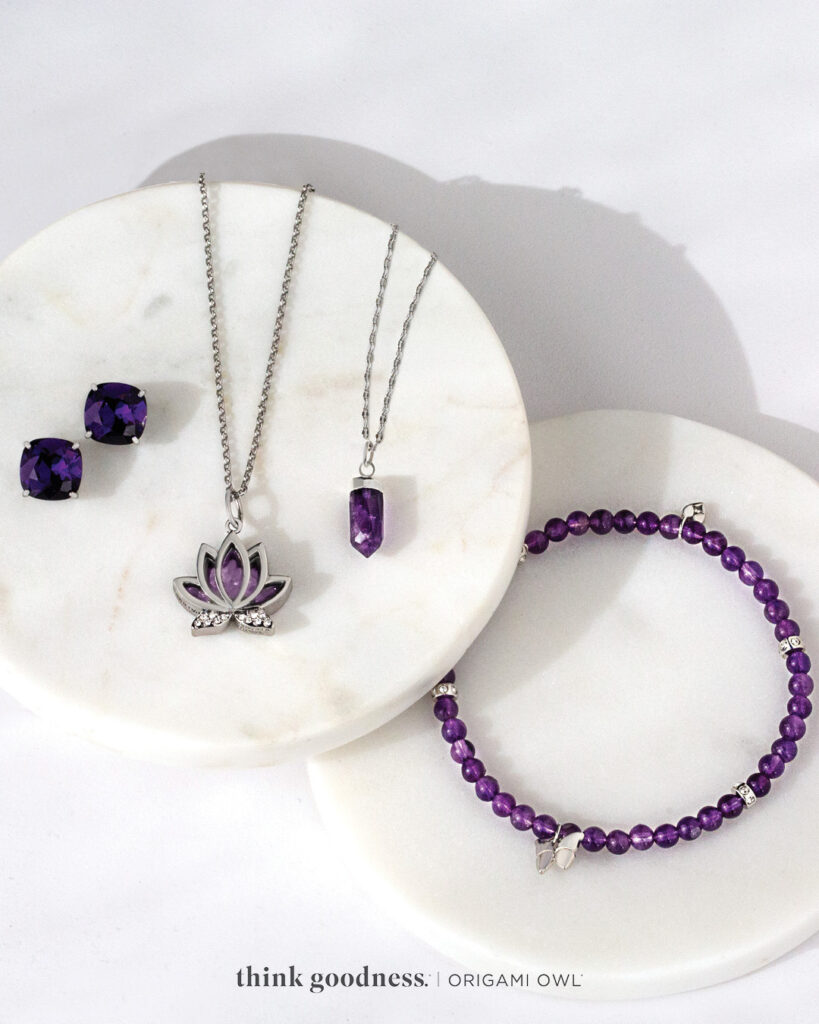 2 marble plates with purple velvet Carla studs, purple beaded bracelet, lotus necklace on a chain, a purple crystal on a chain