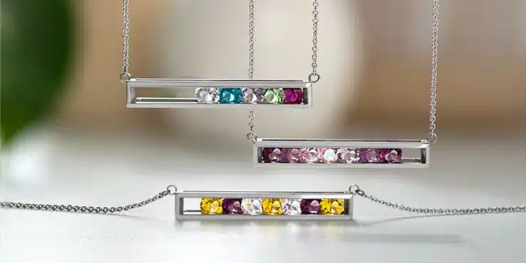 3 silver birthstone bar necklaces that have no glass and include different birthstones in each
