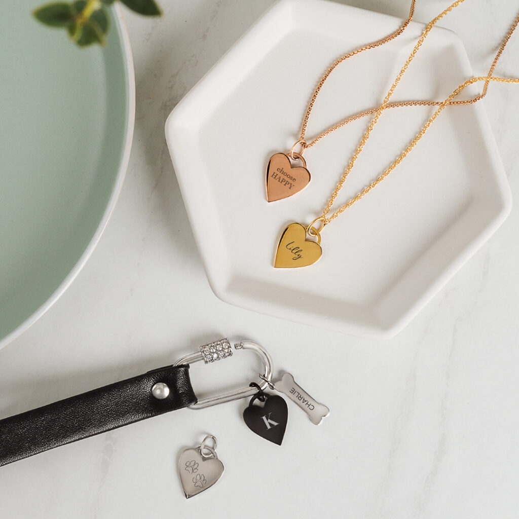 An image of a gold, rose gold and silver heart pendants on chains
