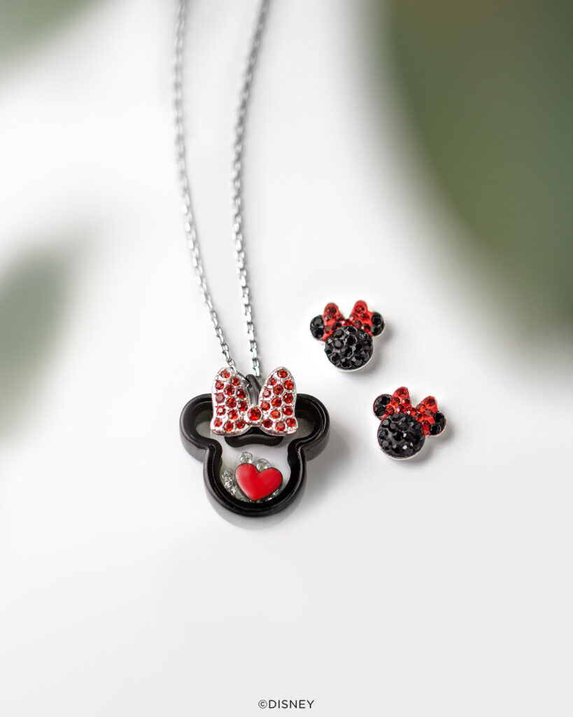 Minnie Mouse black capsule locket on a silver chain and black crystal Minnie ear earrings sign red bows