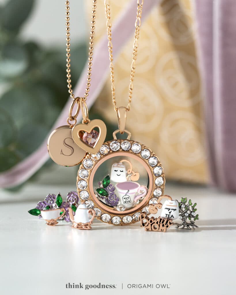 A rose Gold Living Locket for Mothers Day that has charms, a Birthstone heart 