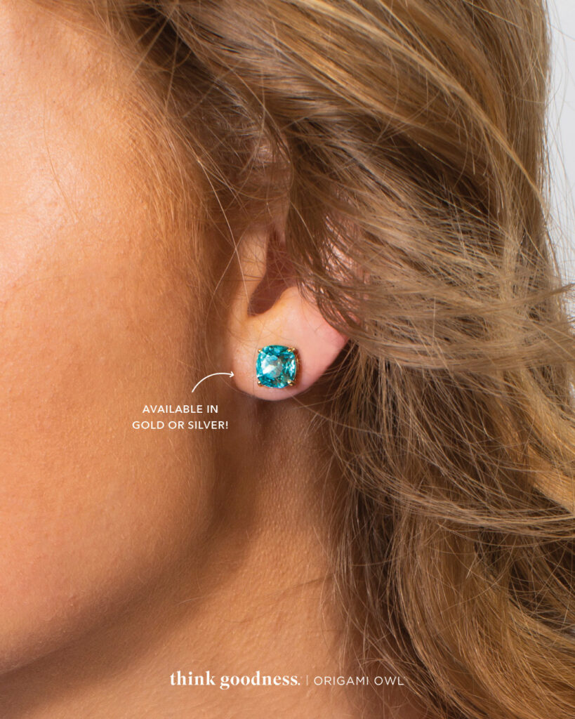 an image of the side of the side of a woman's face showing the light turquoise mini clara stud earrings.