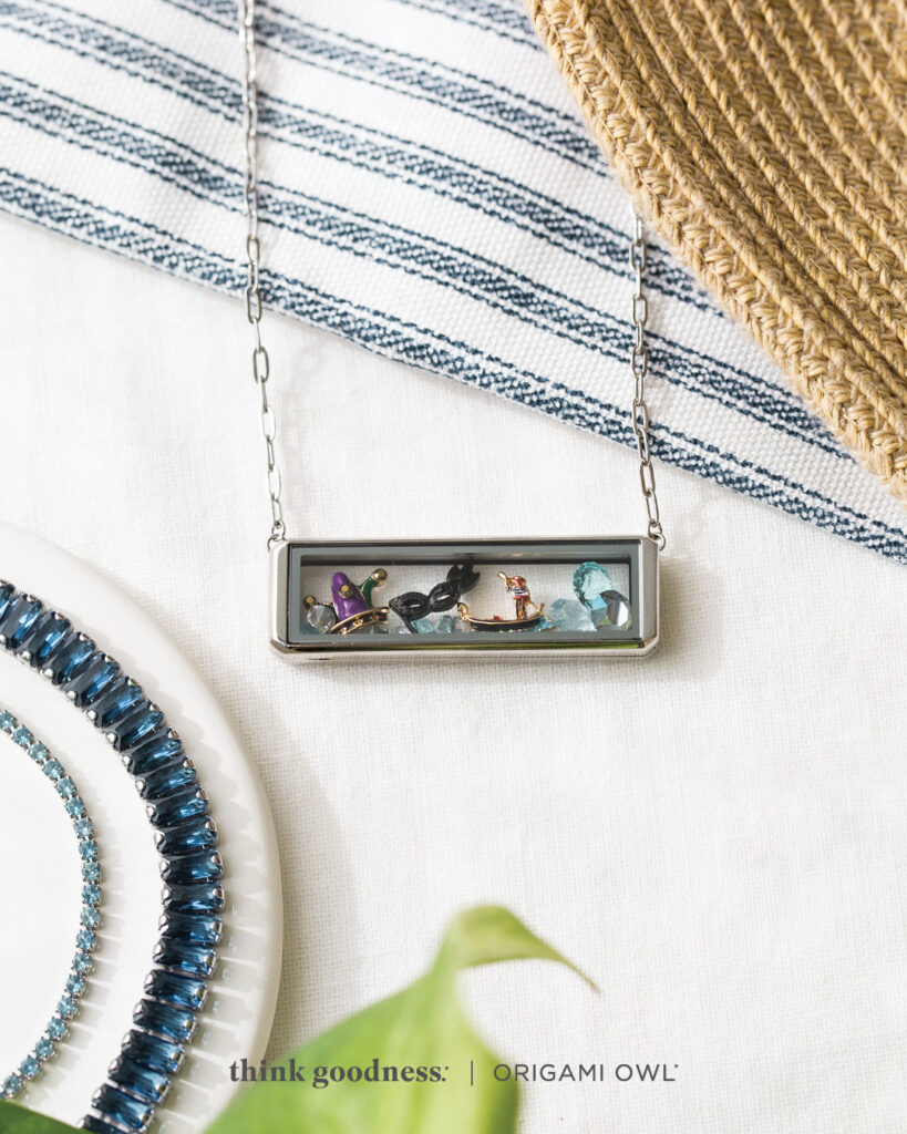 A silver bar living locket with summer charms which is a part of the origami owl summer jewelry collection 