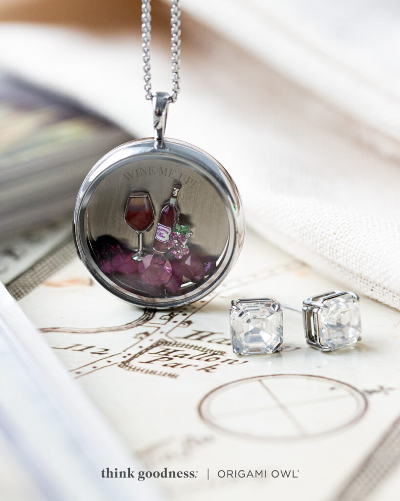A silver round modern locket with summer charms which is a part of the origami owl summer jewelry collection 