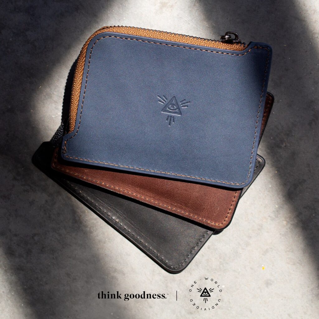 An image of 3 undivided wallets in navy, tan and black