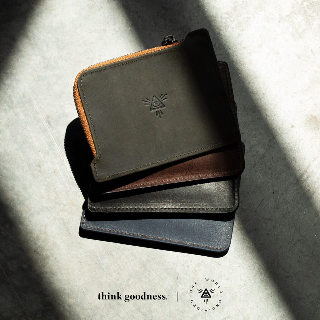 An image of 4 ‘the undivided wallet in olive, brown, black and navy which is the best product to alleviate why you shouldn't use a thick wallet