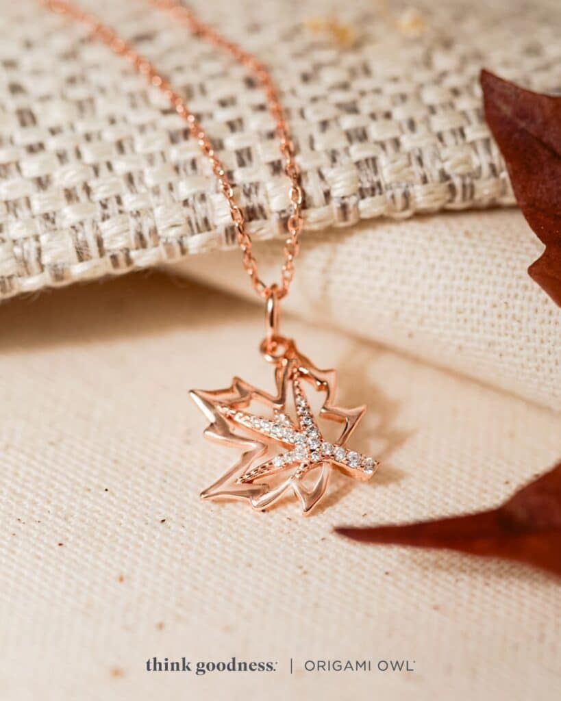 a weaved background with the rose gold begin again leaf necklace with chain for fall season 2023