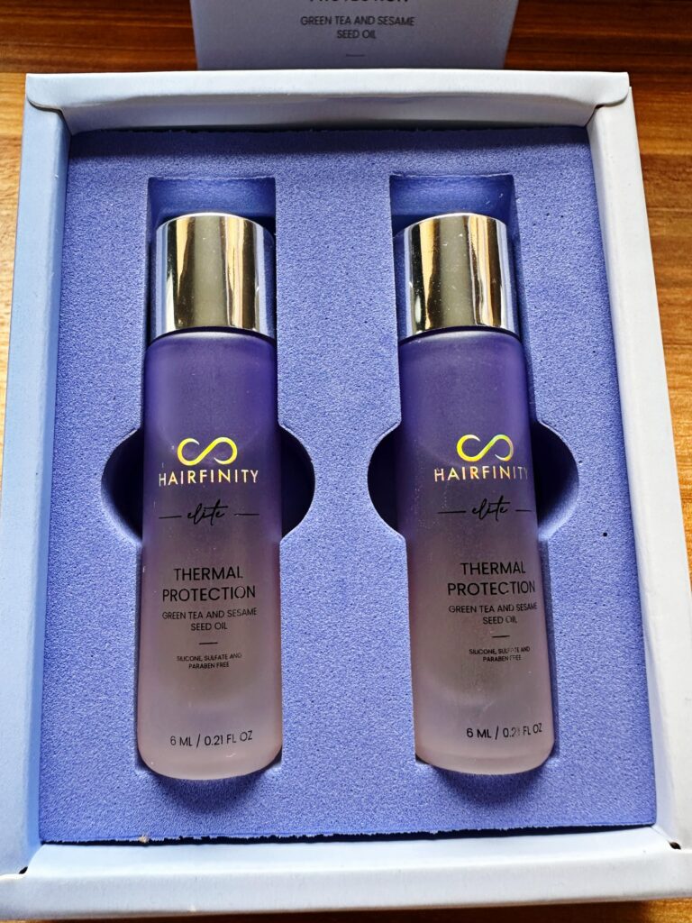 An image showing the Hairfinity Elite package of 2 Thermal Protection Power Shots that are in Purple bottles