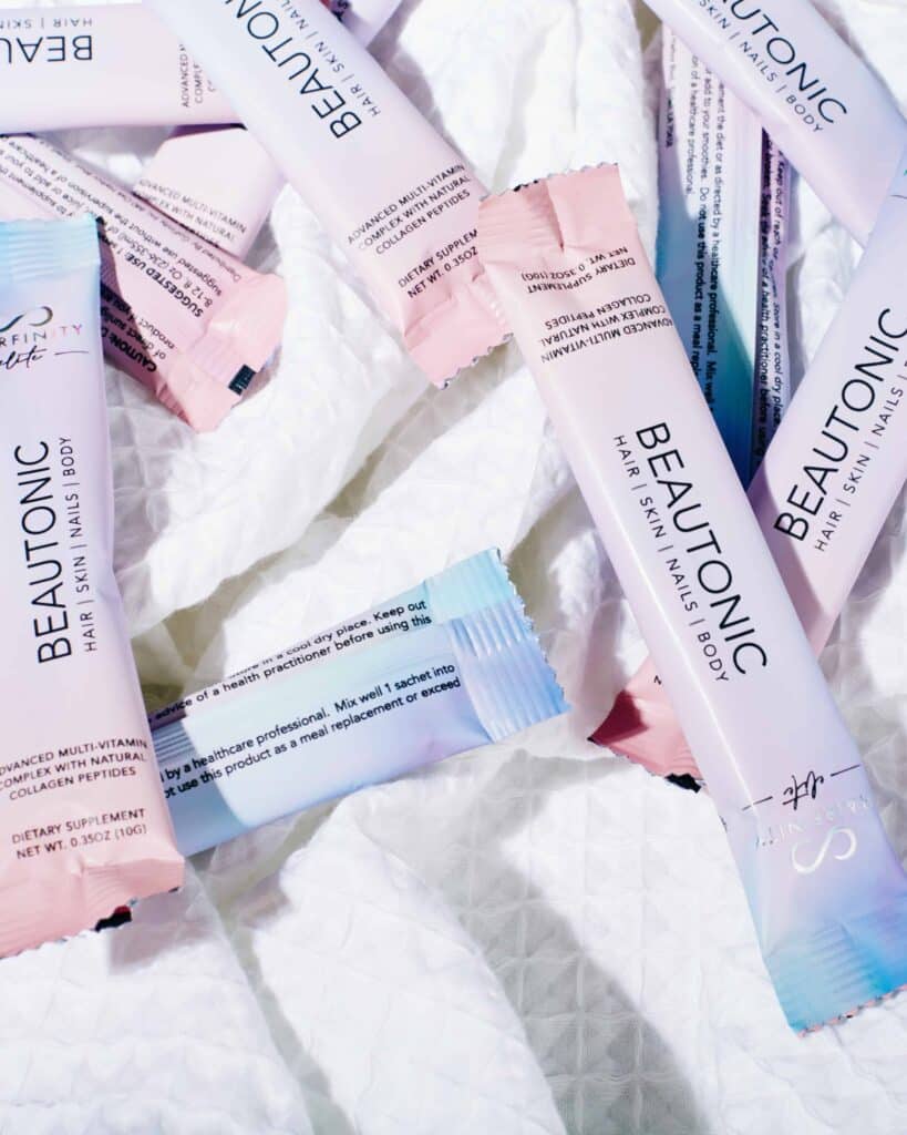  a white image with several packets of Hairfinity Elite Beautonic
