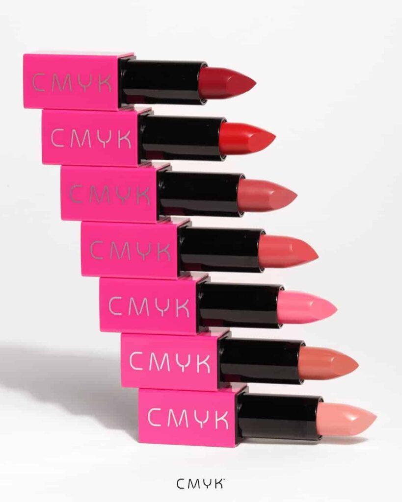a white background showing the 7 shades of limitless natural vegan lipsticks all stacked horizontally